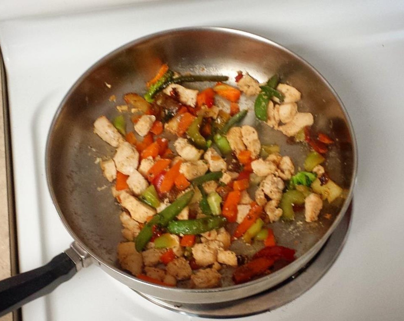 step 1 Grease a deep frying pan or wok with Olive Oil Cooking Spray (as needed). Chop Boneless, Skinless Chicken Breasts (2) into cubes, then cook with Simply Organic Garlic Powder (2 tsp), Ground Cumin (1 tsp), Seasoned Salt (1 tsp), and Ground Black Pepper (1 tsp) until chicken is white all through.