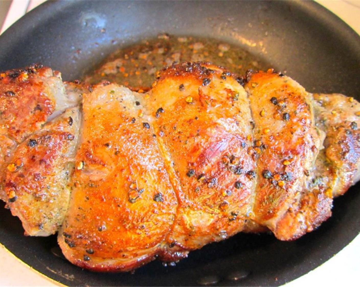 step 2 Season Boneless Leg of Lamb (1) with Freshly Ground Black Pepper (to taste), Kosher Salt (to taste), Cayenne Pepper (to taste), and Granulated Garlic (1 pinch). Sear on all sides until golden brown.