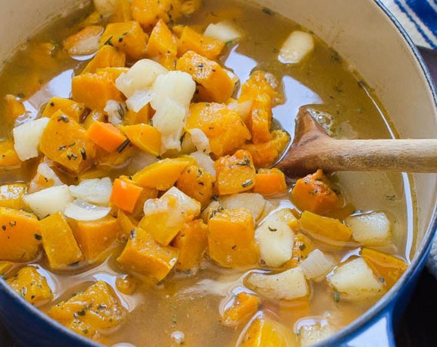 step 3 Add the oven-roasted Butternut Squash (6 1/2 cups) and Vegetable Broth (6 cups). Heat just to boiling, then reduce heat to low and cover with the lid slightly askew. Simmer for 10 minutes.