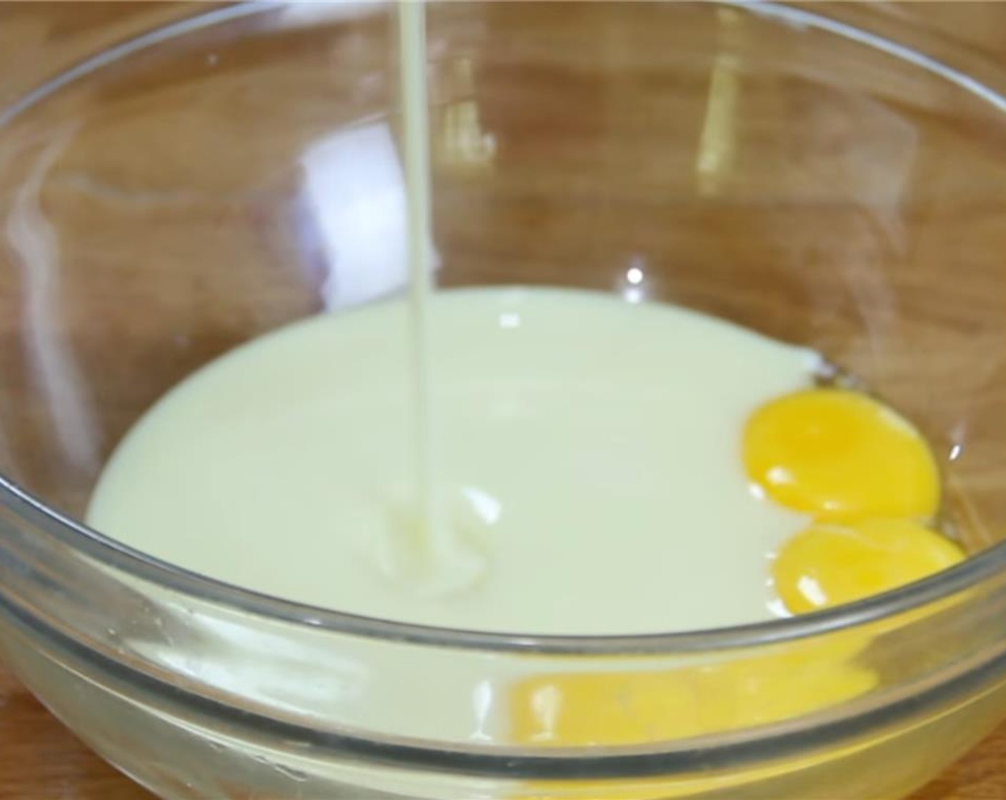 step 2 Combine the Eggs (4) and Sweetened Condensed Milk (1 1/3 cups) in a bowl and whisk until they are well combined.