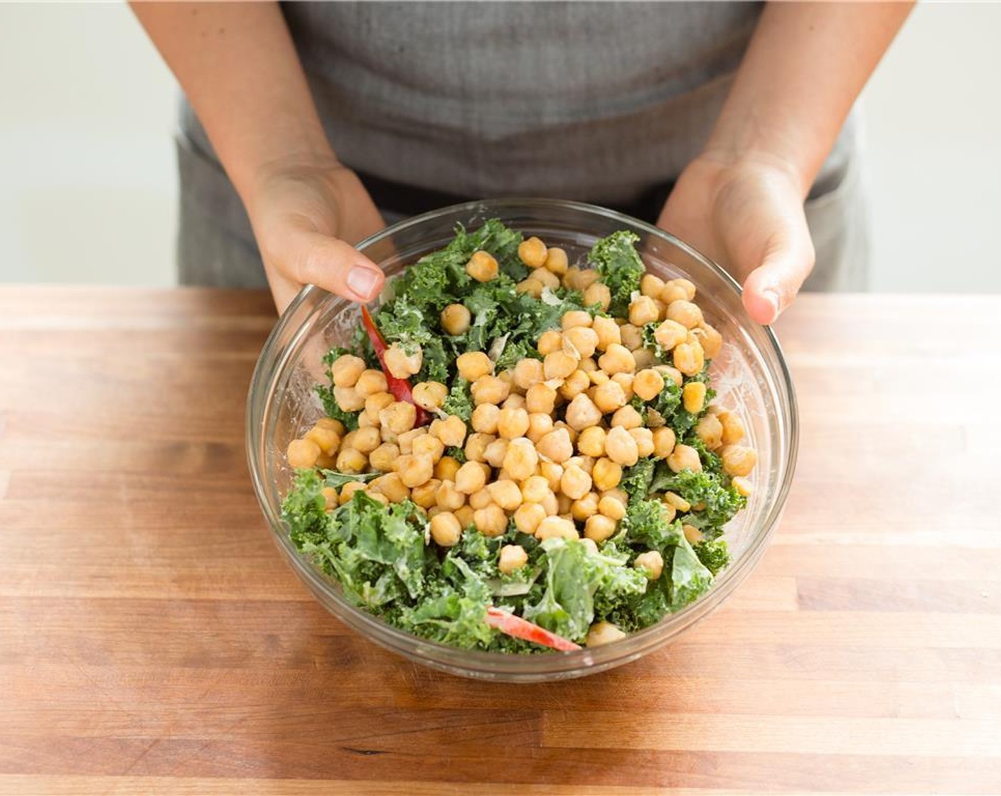 step 15 Add the red bell pepper, chickpeas, and Kale (6 3/4 cups) the bowl with the dressing. Toss to combine.