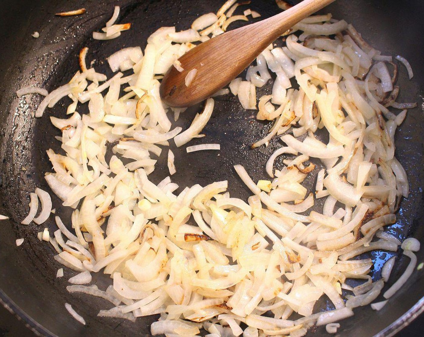 step 6 Sauté sliced onions in Butter (1/2 cup).