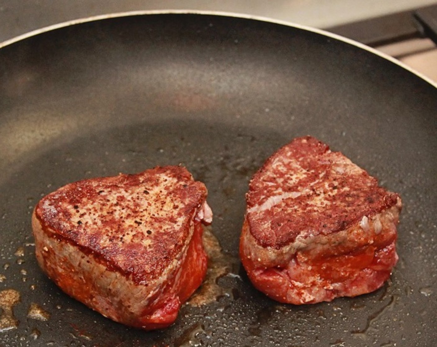 step 8 Heat a sauté pan over medium-high heat, add Cooking Oil (as needed) and add the Filet Mignon. Cook beef without turning for about 2 minutes, or until well browned.