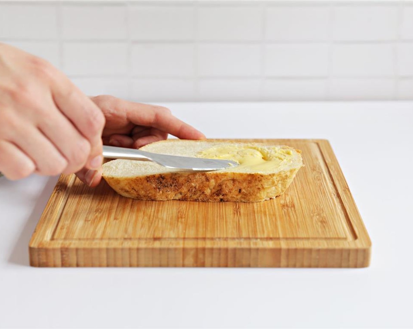 step 4 Spread 1 slice of bread with Unsalted Butter (1/2 Tbsp).