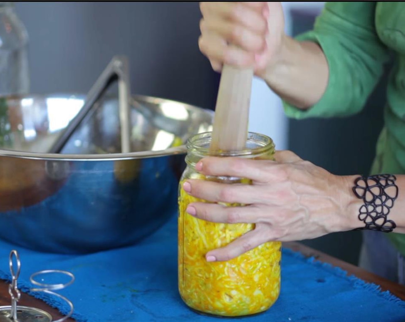 step 6 Pack everything, into a quart-size, wide-mouth 1-quart mason jar. Using a mortar, or wooden spoon, pound down the mixture to help release more liquid.