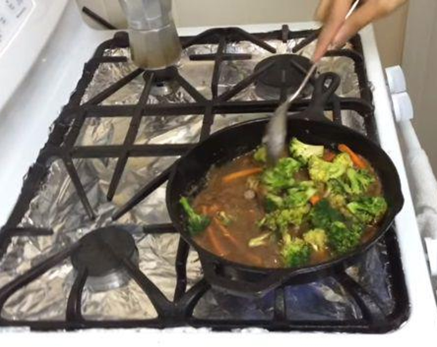 step 4 In the same frying pan, add the remaining Corn Oil (2 Tbsp). Then add in and cook the Broccoli Florets (6 cups), Onion (1), and Carrot (1) for about 5 minutes.