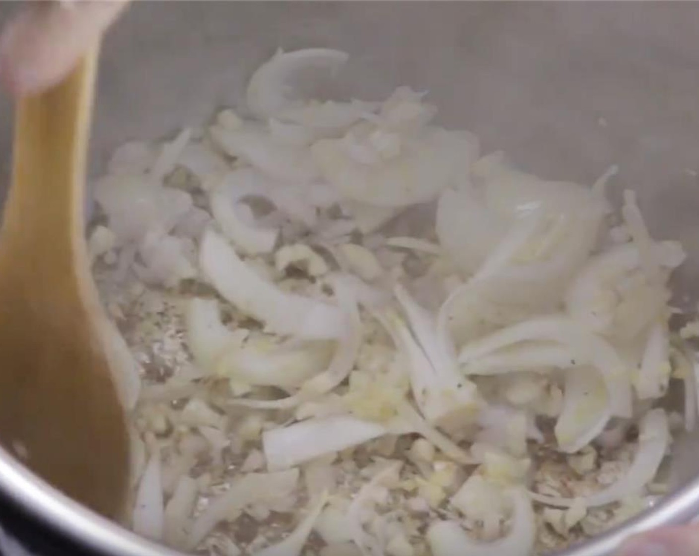 step 4 Reduce the heat to medium. Add Olive Oil (1 Tbsp) into the pot, then add in the Onions (2), Fresh Ginger (1 Tbsp), and Shallot (1); then stir for roughly a minute.