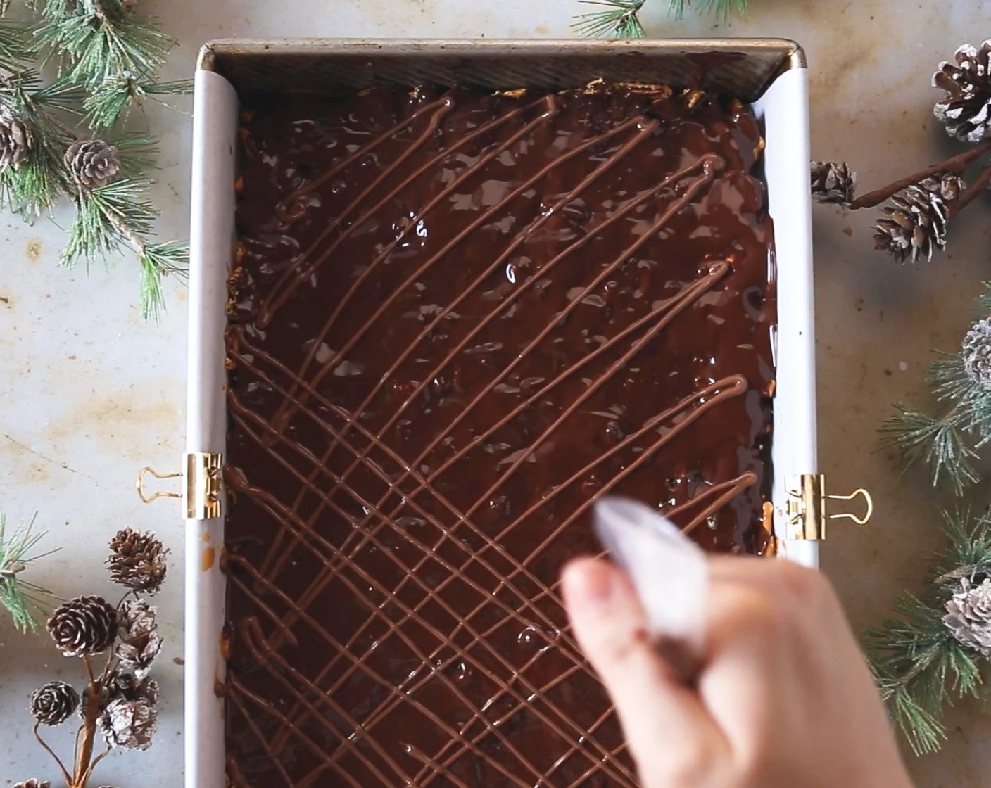 step 6 Melt the Milk Chocolate (1 cup) and 1 teaspoon coconut oil together in the microwave in 30-second increments until melted. Drizzle the milk chocolate over the bars.