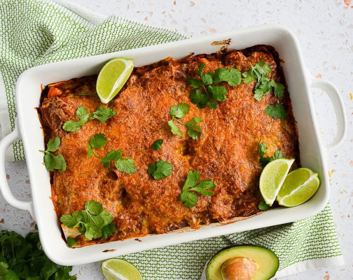 step 14 Take out of the oven and use a spatula to slice into four pieces. Serve in bowls or plates, with toppings such as Lime (1), Avocado (1), Fresh Cilantro (1 bunch), and Jalapeño Pepper (1) on top or on the side! Enjoy!