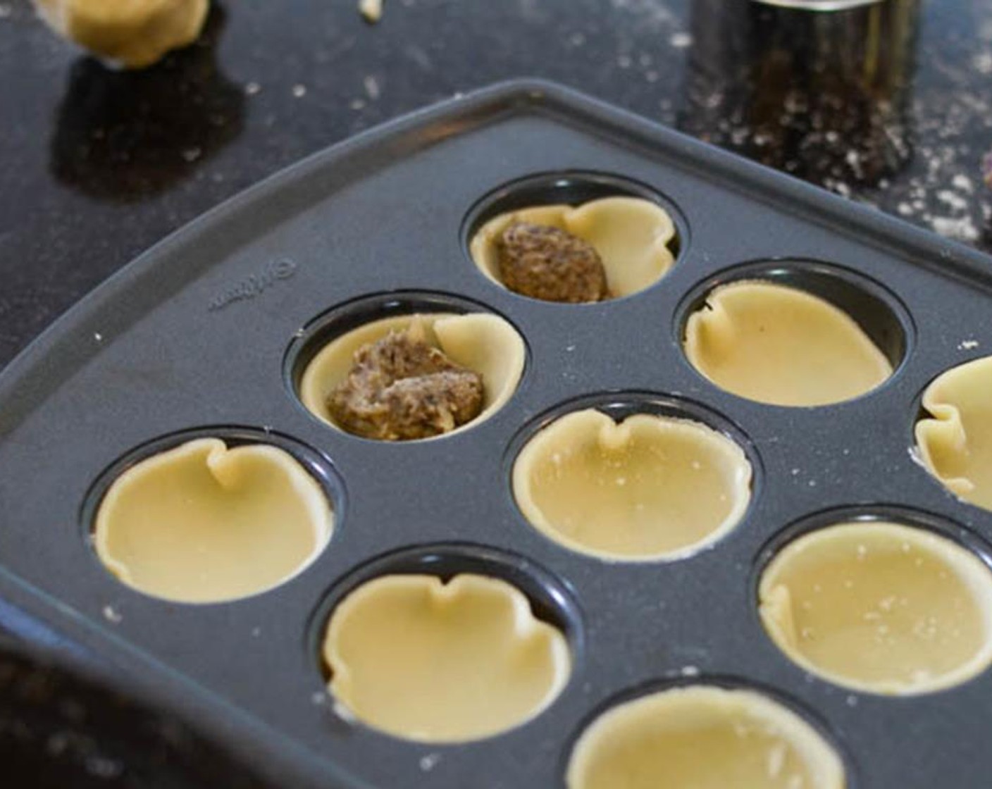 step 8 Fill the pastry cups with 1 teaspoon of mushroom filling.
