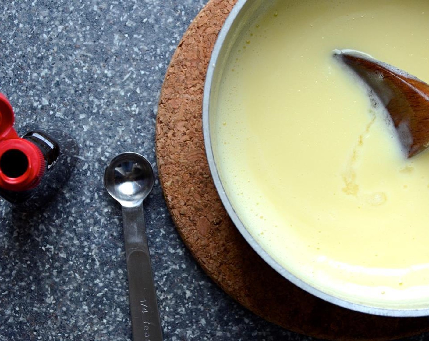 step 8 Remove the custard from the heat. Set a strainer over a large bowl and pour the custard through the strainer to remove any egg solids. Let the custard cool slightly.