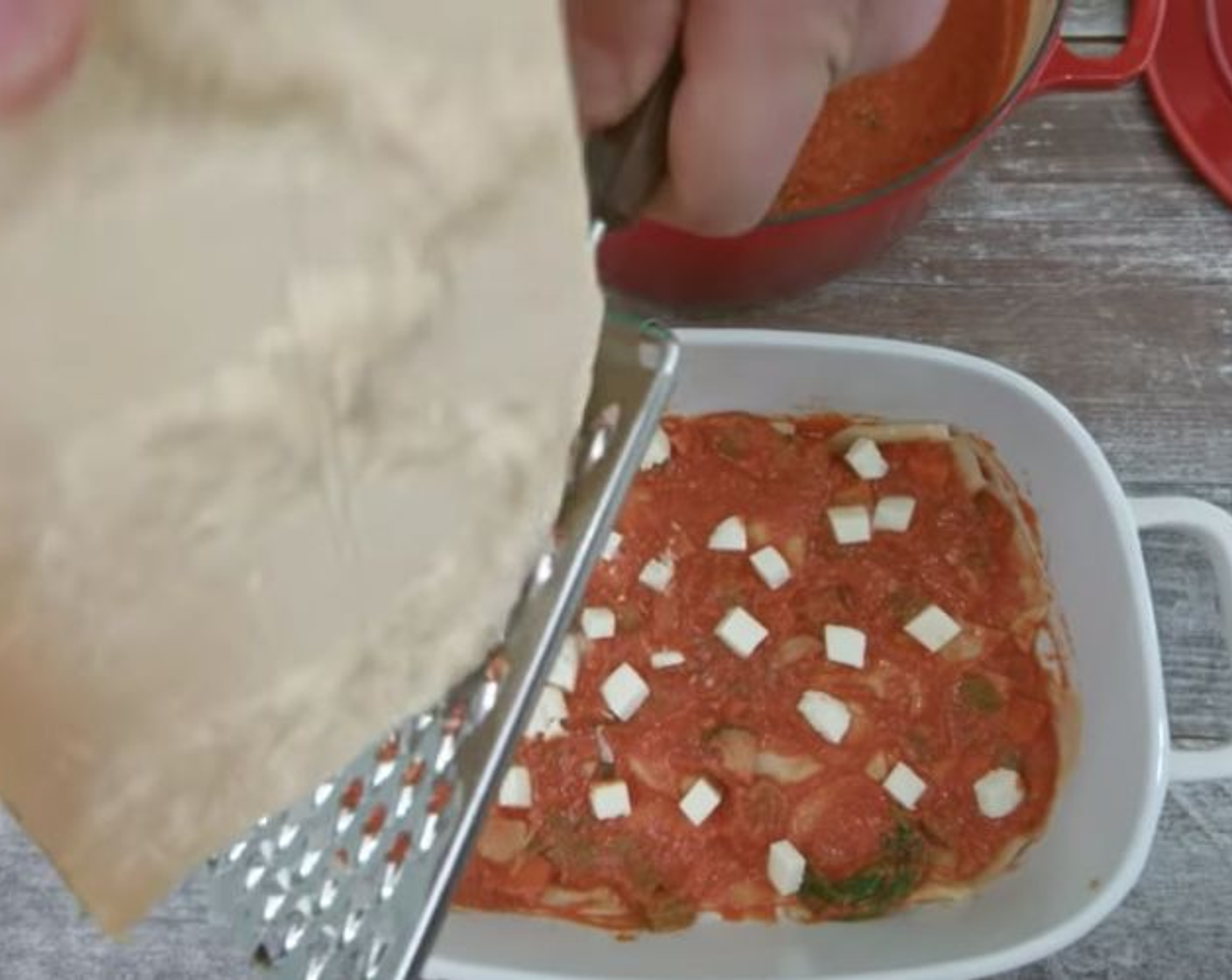 step 19 Grate a generous amount of Grated Parmesan Cheese (to taste) over the top and then begin a new layer.