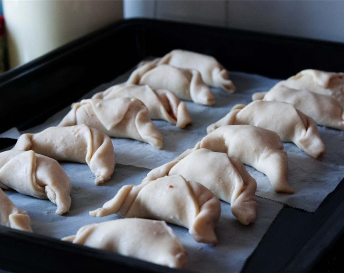 step 6 Roll the puff pastry from one corner to the other into a croissant shape.