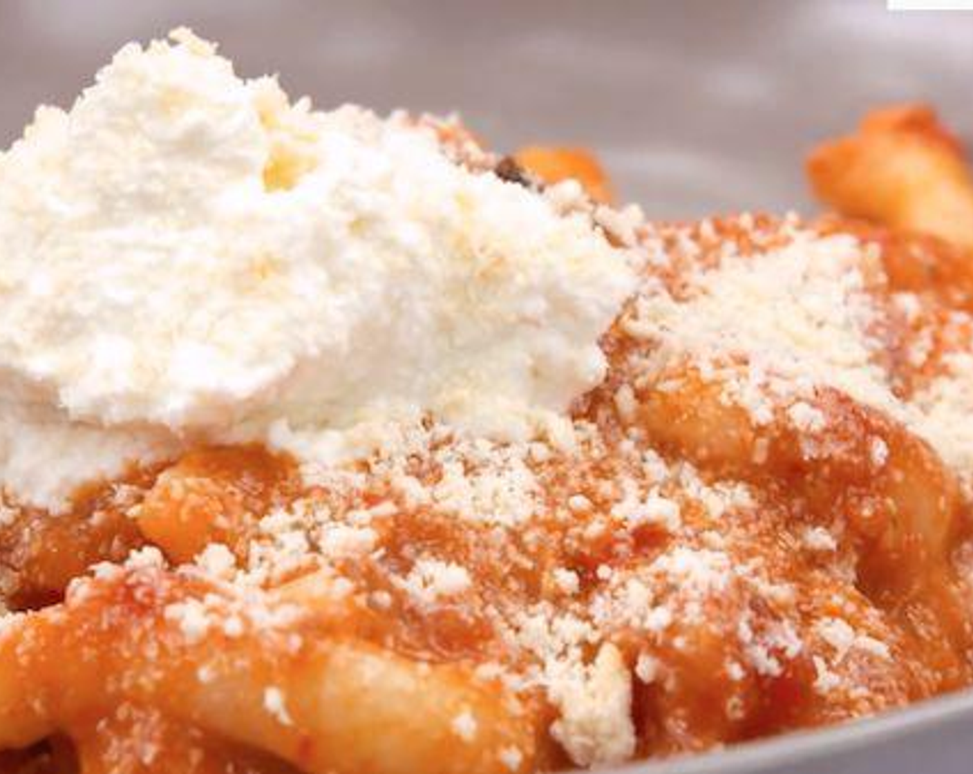 step 6 To serve the pasta, place a spoonful of Tomato Sauce (to taste) in a bowl, add the pasta on top followed with Pecorino Romano Cheese (to taste). Repeat and mix thoroughly. Serve with Ricotta Salata Cheese (to taste) and enjoy!