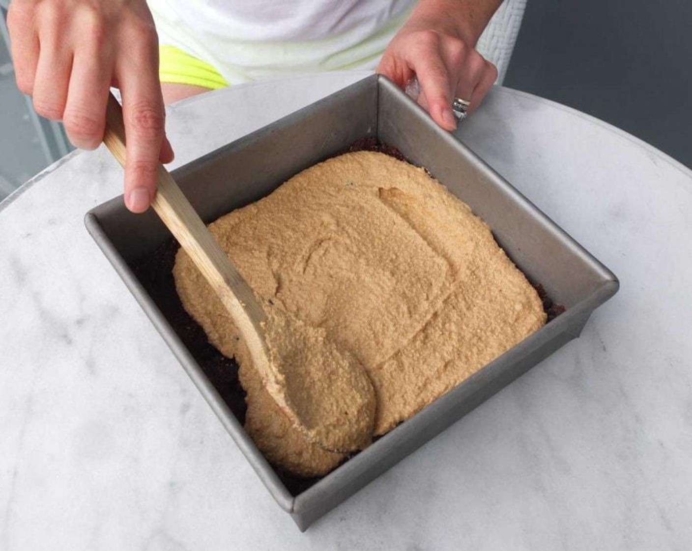 step 3 Place the Cashew Nuts (2 cups), Coconut Oil (4 Tbsp), Vanilla Extract (1 tsp) and Apricots (10) in a food processor or blender and blend until smooth. Remove the crust from the fridge and spread the cream on top.