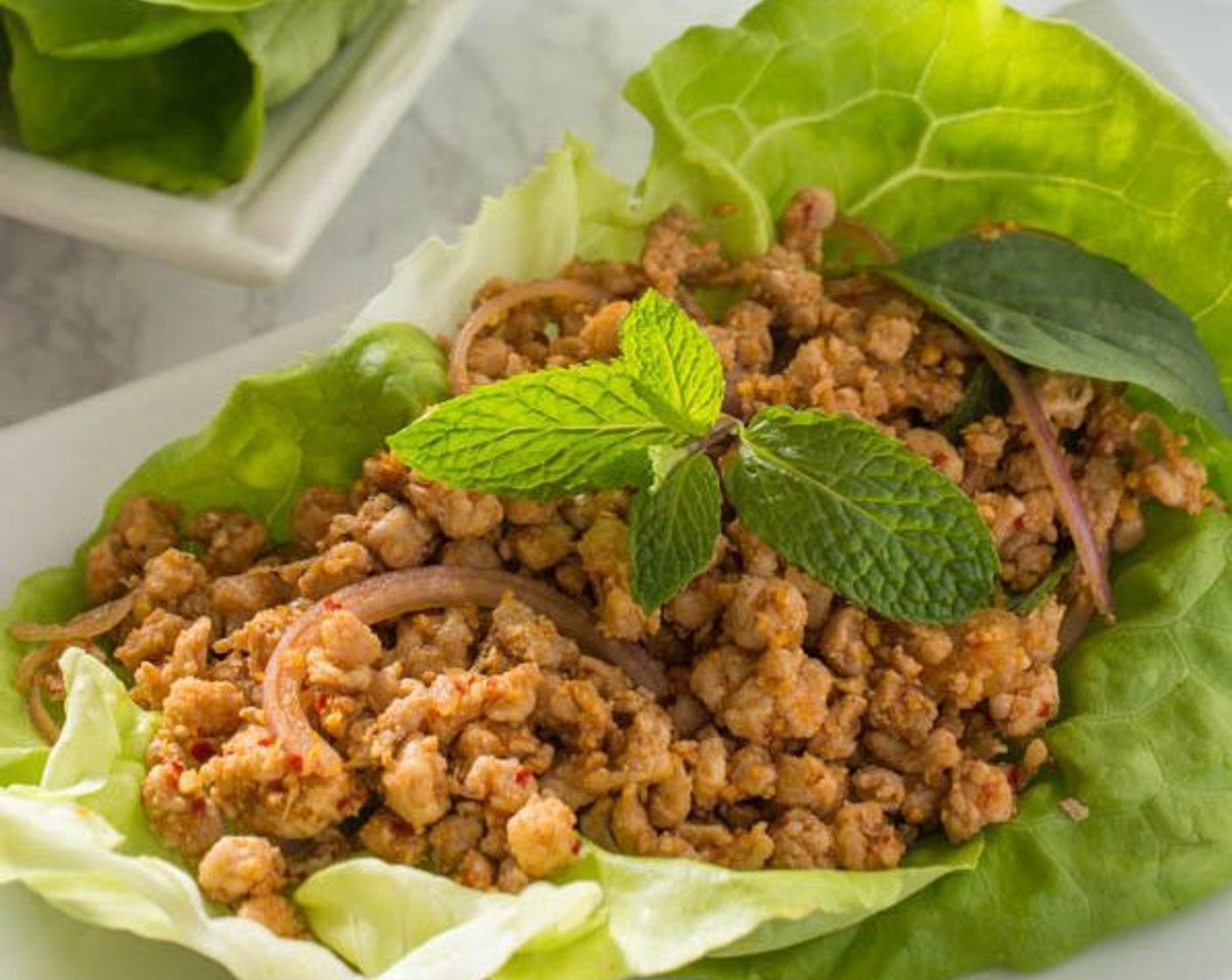 step 10 Transfer the pork to a serving bowl, then serve with Romaine Lettuce (1 head) leaves.