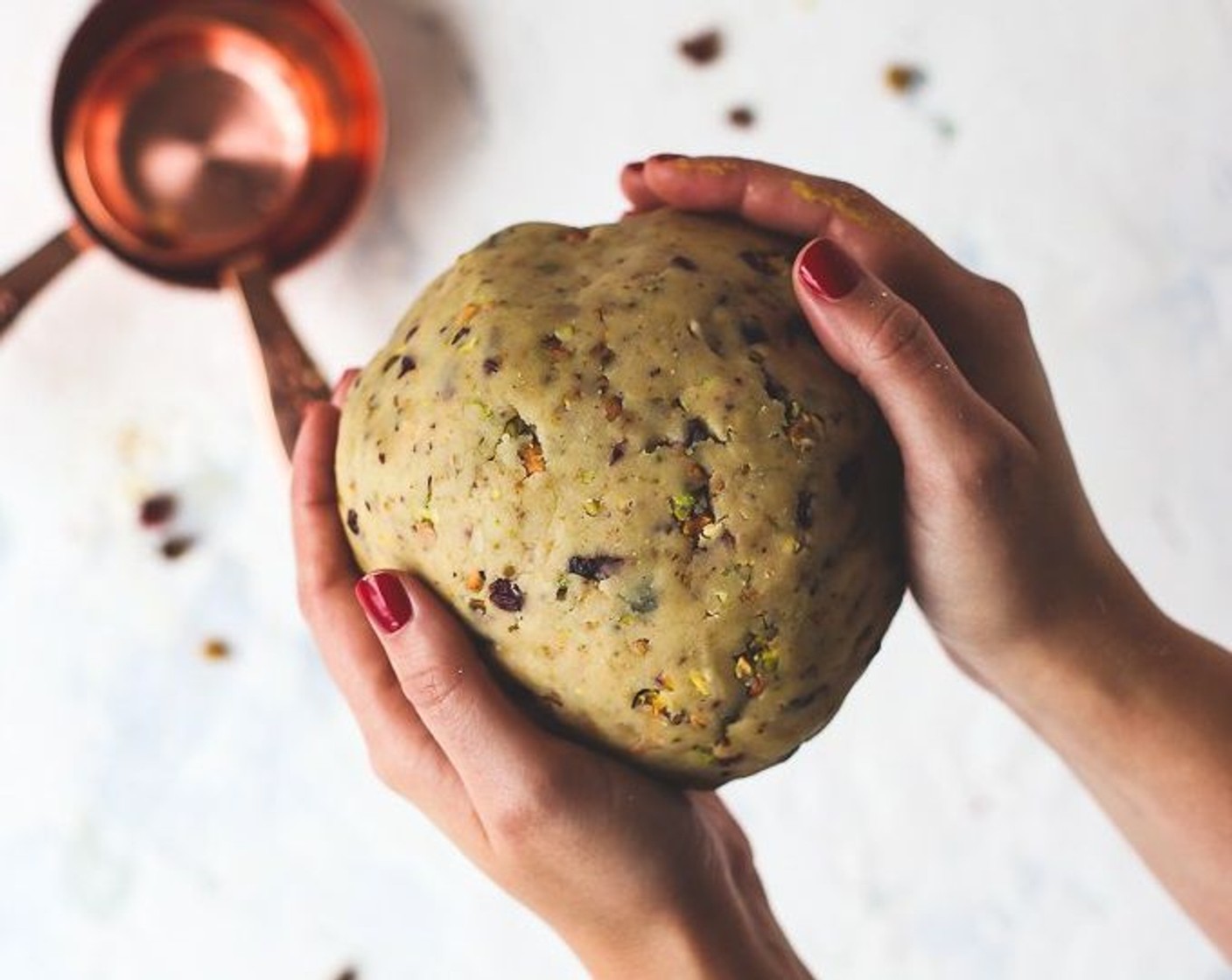 step 3 Knead dough by hand until it forms into a ball. Seperate the dough in half and form each into a disk. Wrap them in plastic wrap, and refrigerate for 30 minutes.