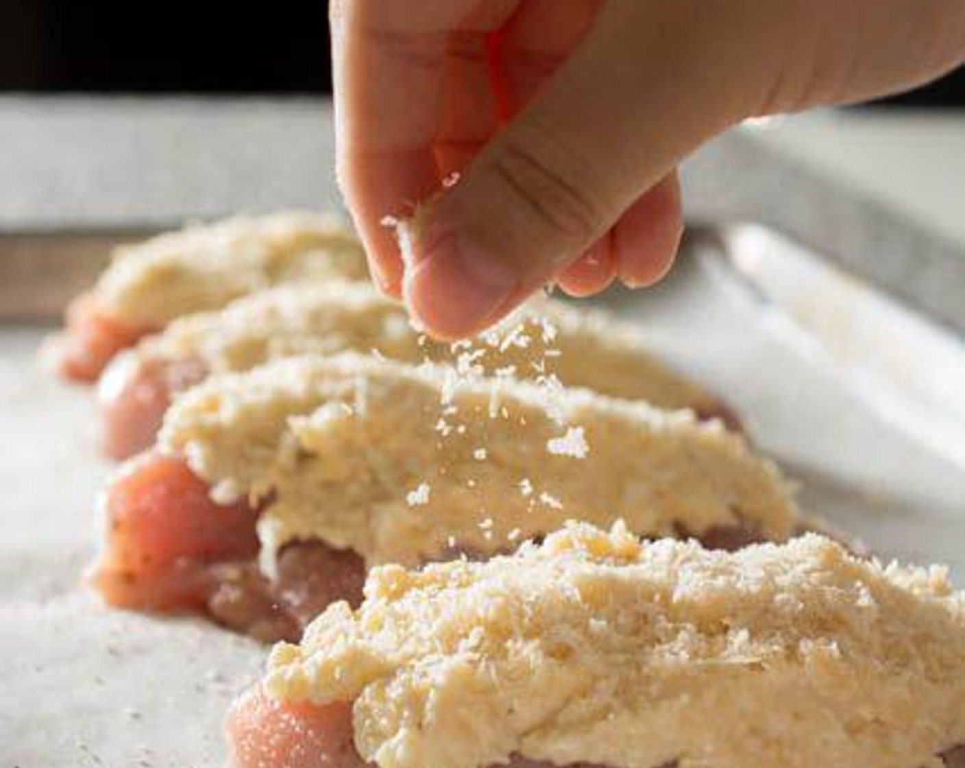 step 6 Top each chicken breast with the remaining Panko Breadcrumbs (4 Tbsp).