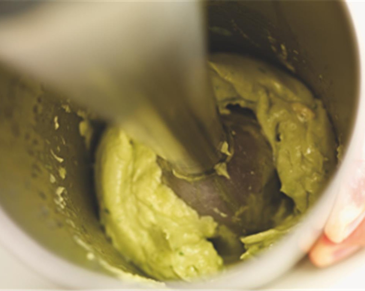 step 2 Combine the avocado with the lime juice, garlic, Olive Oil (2 Tbsp), Tabasco® Original Red Pepper Sauce (1 tsp), chopped Fresh Chives (1 Tbsp) and Sea Salt (1/2 tsp). Blend until you have a light
green puree.