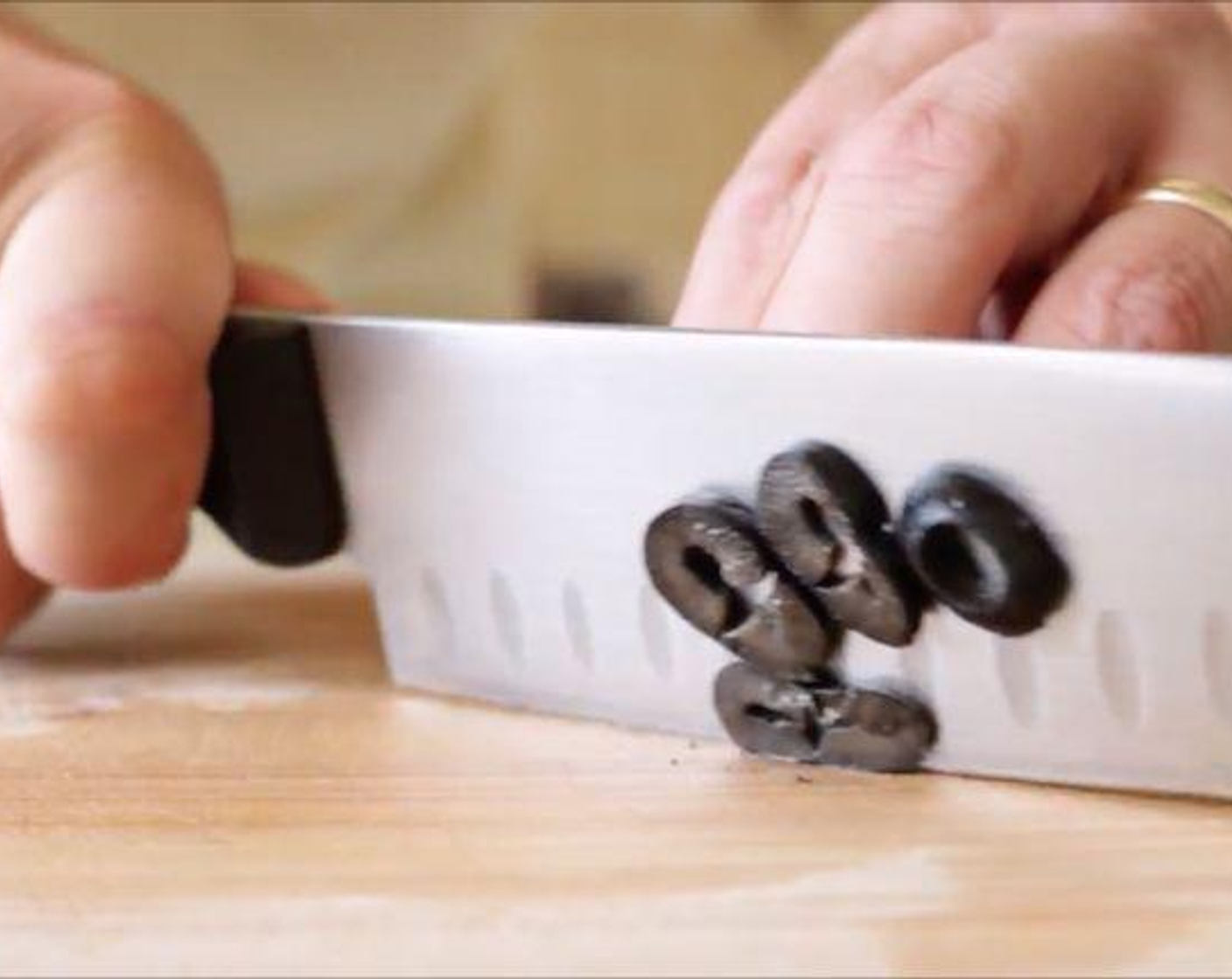 step 3 Thinly slice the Black Olives (4 Tbsp).
