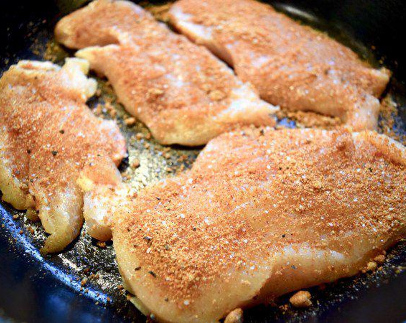 step 3 Reserve 1 tsp of the spice mix and then use the rest of the spice mix to generously coat Chicken Breast (1 lb). Once the chicken is seasoned, place it in an oven proof skillet and set aside.