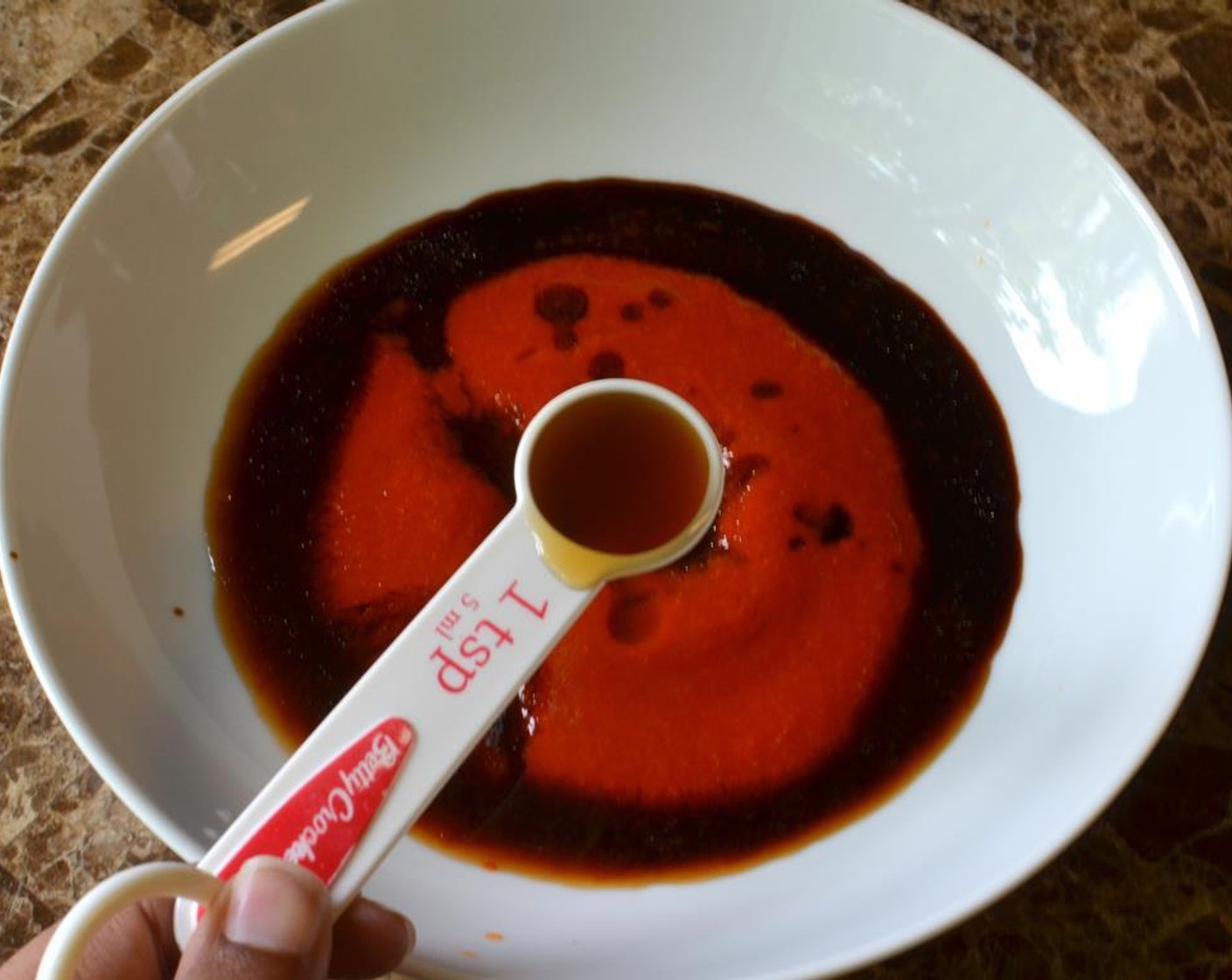 step 1 Start by preparing a marinade for the shrimp. In a shallow bowl or zip lock bag, add the Sriracha (3 Tbsp), Rice Vinegar (1 tsp) and Sesame Oil (1 tsp) and Soy Sauce (1 Tbsp). Then grate peeled Garlic (3 cloves) directly into the bowl.