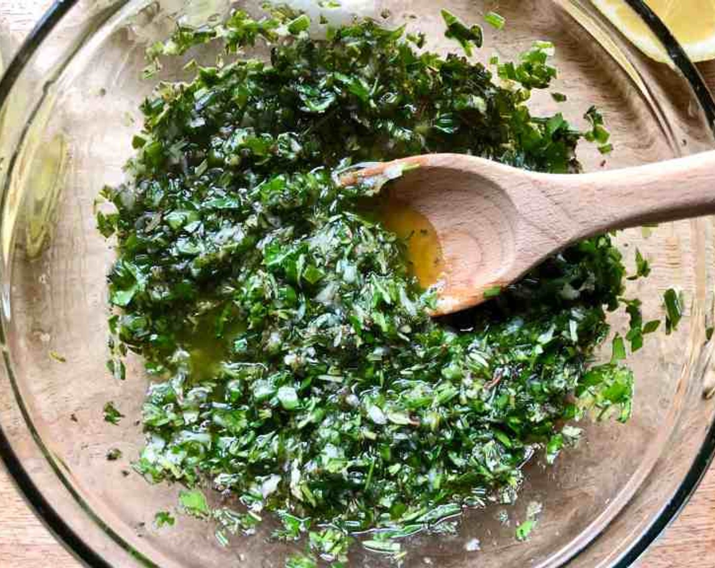 step 2 In a medium-size bowl, stir together the Fresh Parsley (3 Tbsp), Fresh Chives (3 Tbsp), Fresh Thyme (3 Tbsp), Fresh Rosemary (3 Tbsp), Fresh Oregano (3 Tbsp), Garlic (4 cloves), Lemon Zest (1), Lemon Juice, and Olive Oil (1/2 cup) until combined to make a chimichurri style sauce. Set aside.