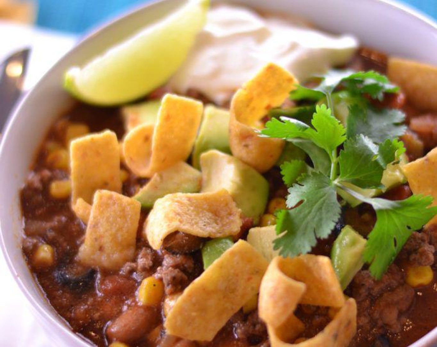 step 6 Serve with Corn Chips (to taste), Avocado (1), Sour Cream (to taste). Garnish with Fresh Cilantro (to taste) and Limes (to taste). Enjoy!