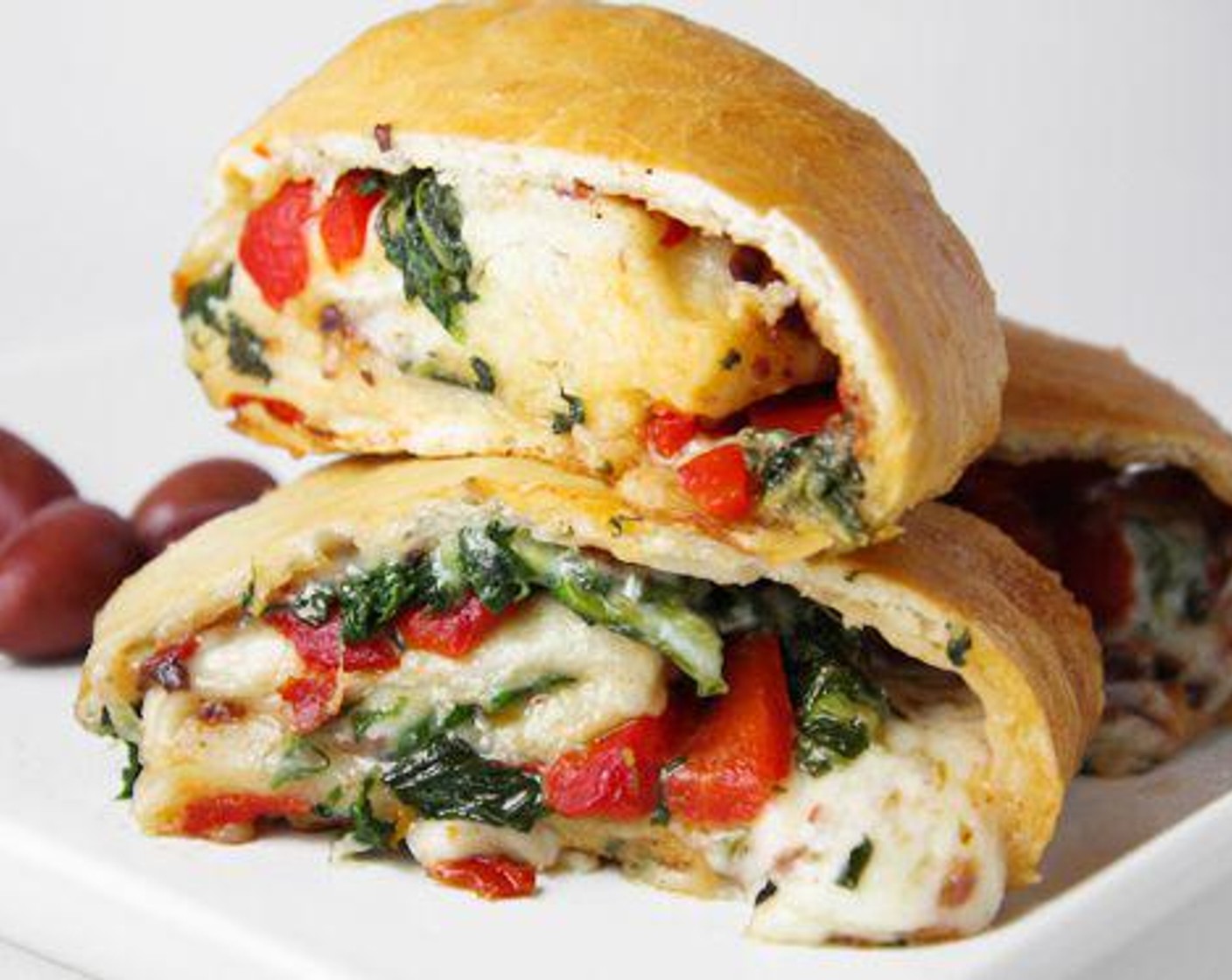 Cheesy Veggie Stromboli with Spinach and Tomatoes
