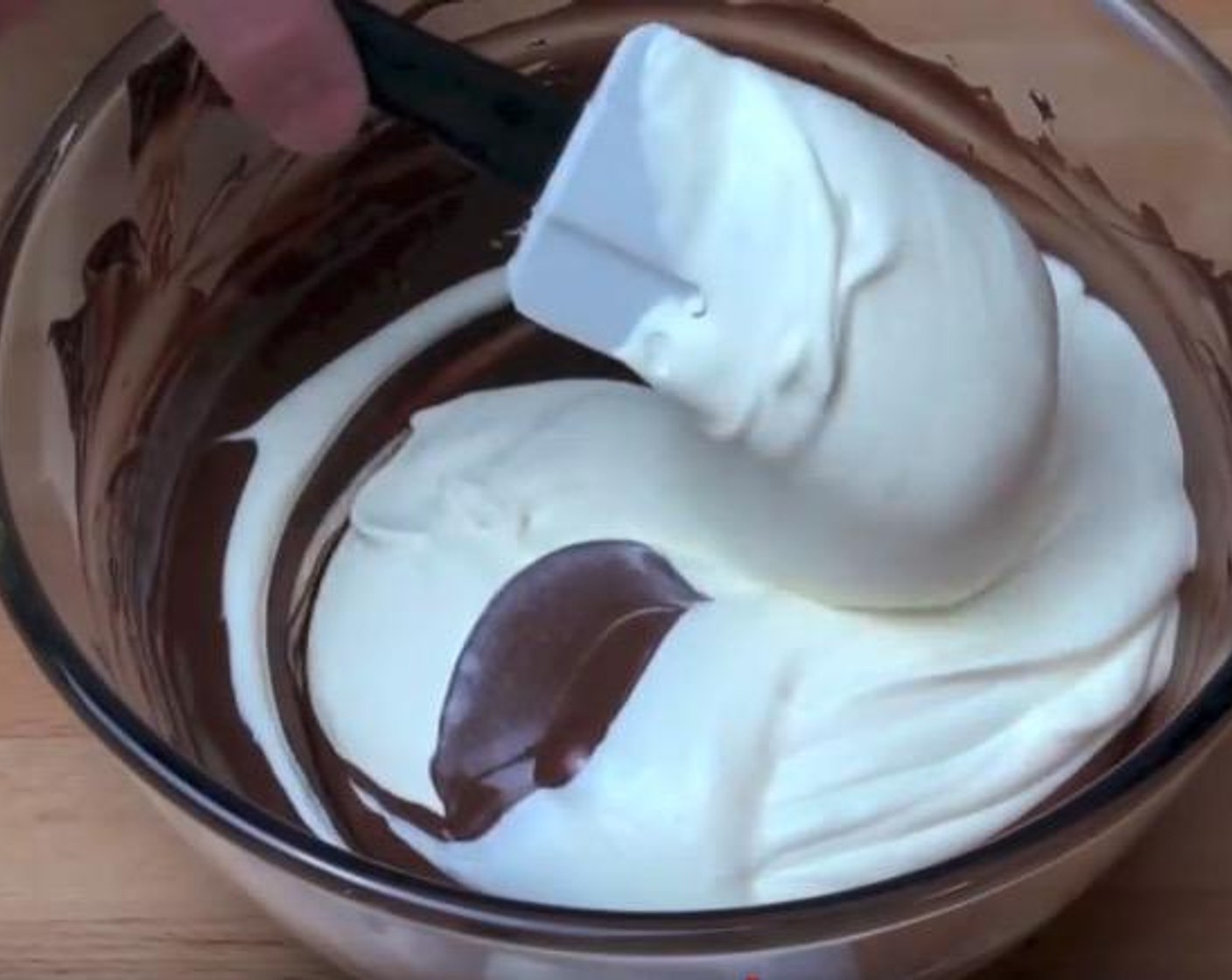 step 6 Gently fold the cream into the cooled chocolate, a bit at a time.