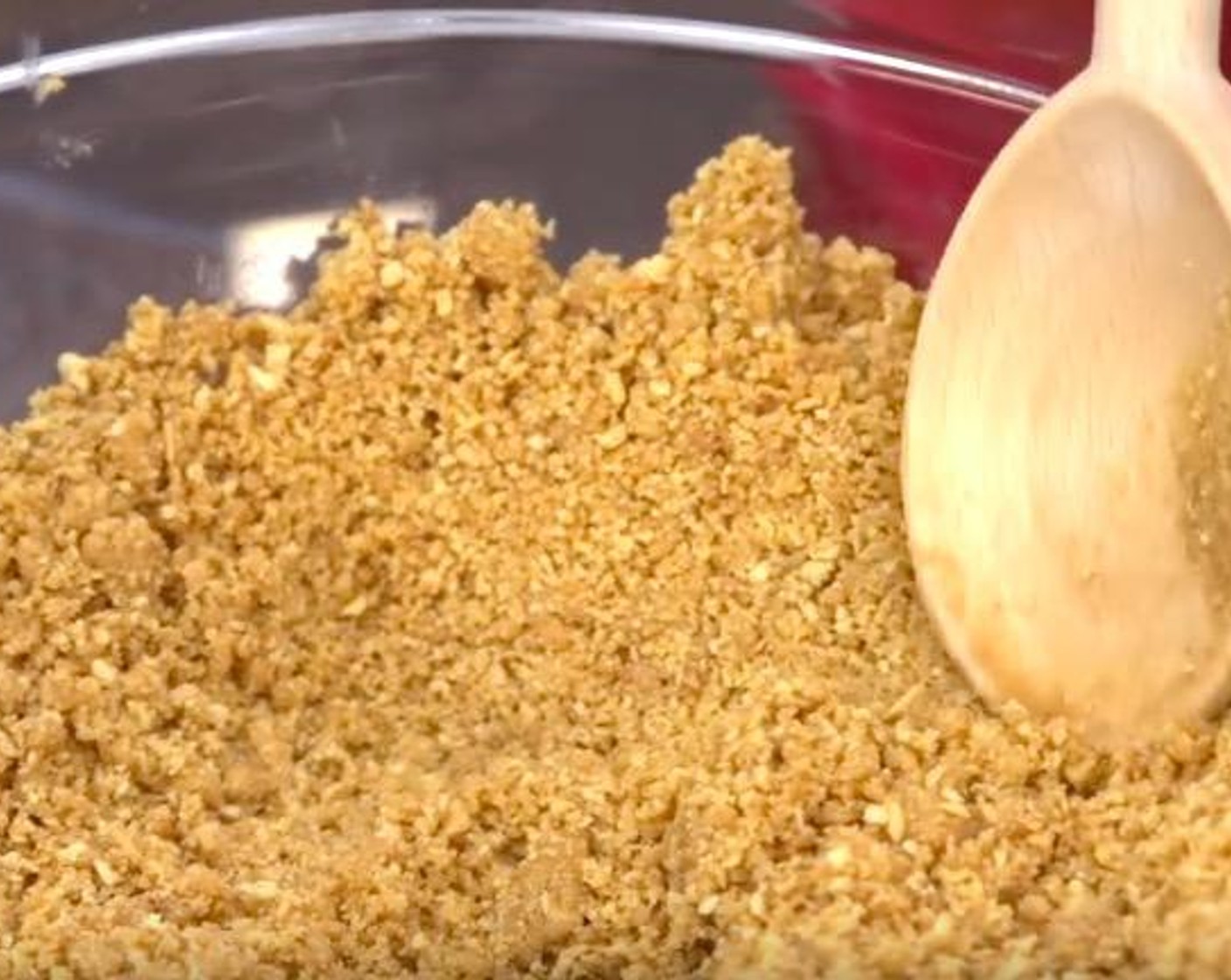 step 1 Put Graham Crackers (3 cups) into the food processor and crush up the cookie. Transfer the cookie crumb into a mixing bowl. Add Butter (1/3 cup) and stir it up until it has the consistency of wet sand.
