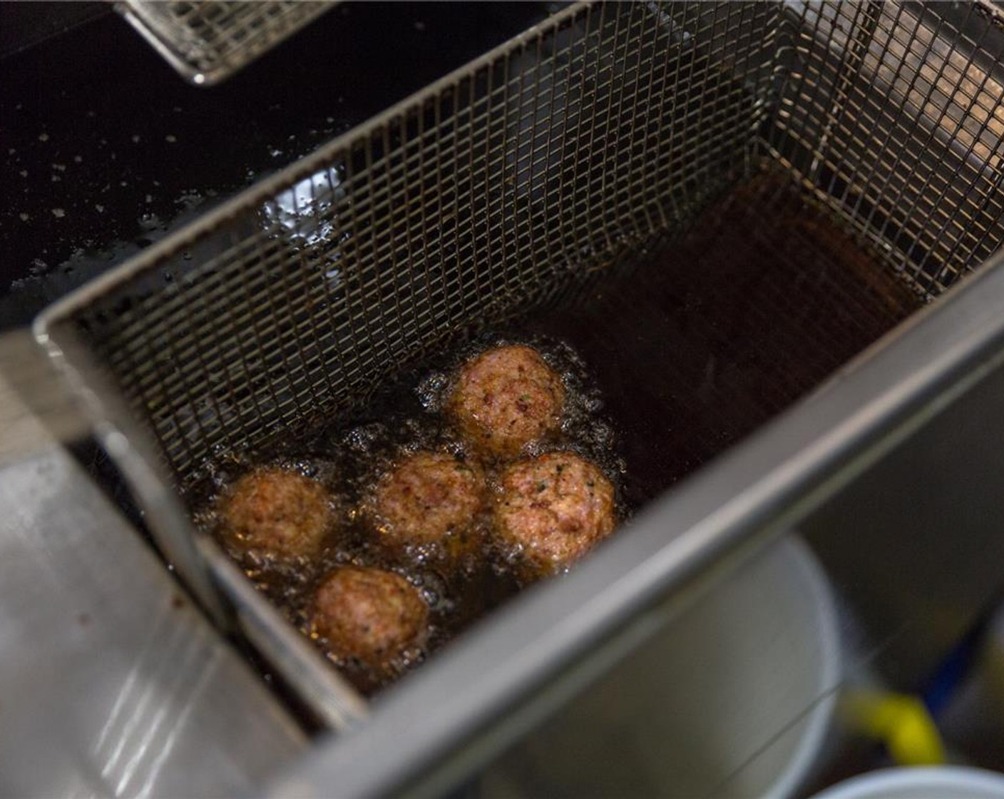 step 5 Put meatballs in the fryer for 2 minutes. Just long enough for the sides to be seared, inside will still be raw.