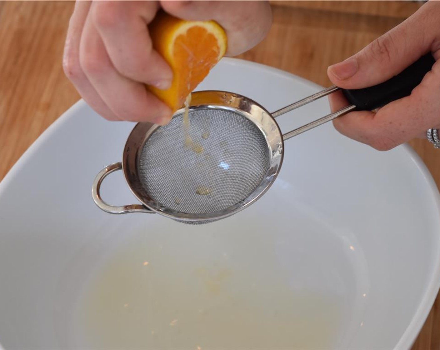 step 1 Start with the vinaigrette: juice the Lemon (1/2), Valencia Orange (1/2) and Lime (1) through a fine mesh strainer into a bowl.