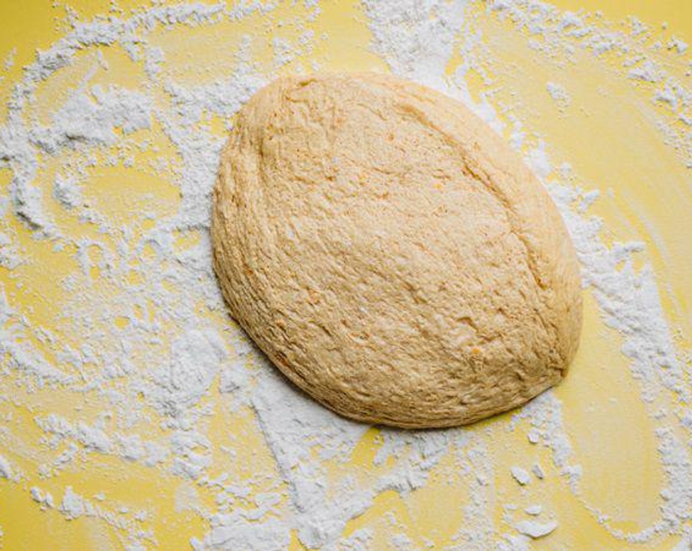 step 2 In separate bowl, whisk together Whole Wheat Flour (1/2 cup) and All-Purpose Flour (2 1/2 cups) then slowly incorporate flour into the potato mixture. When mixture forms a loose ball, throw it onto a floured surface and knead for a few minutes, adding a touch more flour as needed, until you have a smooth dough ball. Rinse out your large bowl, grease it, and set dough back into the bowl. Cover bowl with plastic wrap or a warm wet towel and set somewhere warm. Allow dough to double in size.