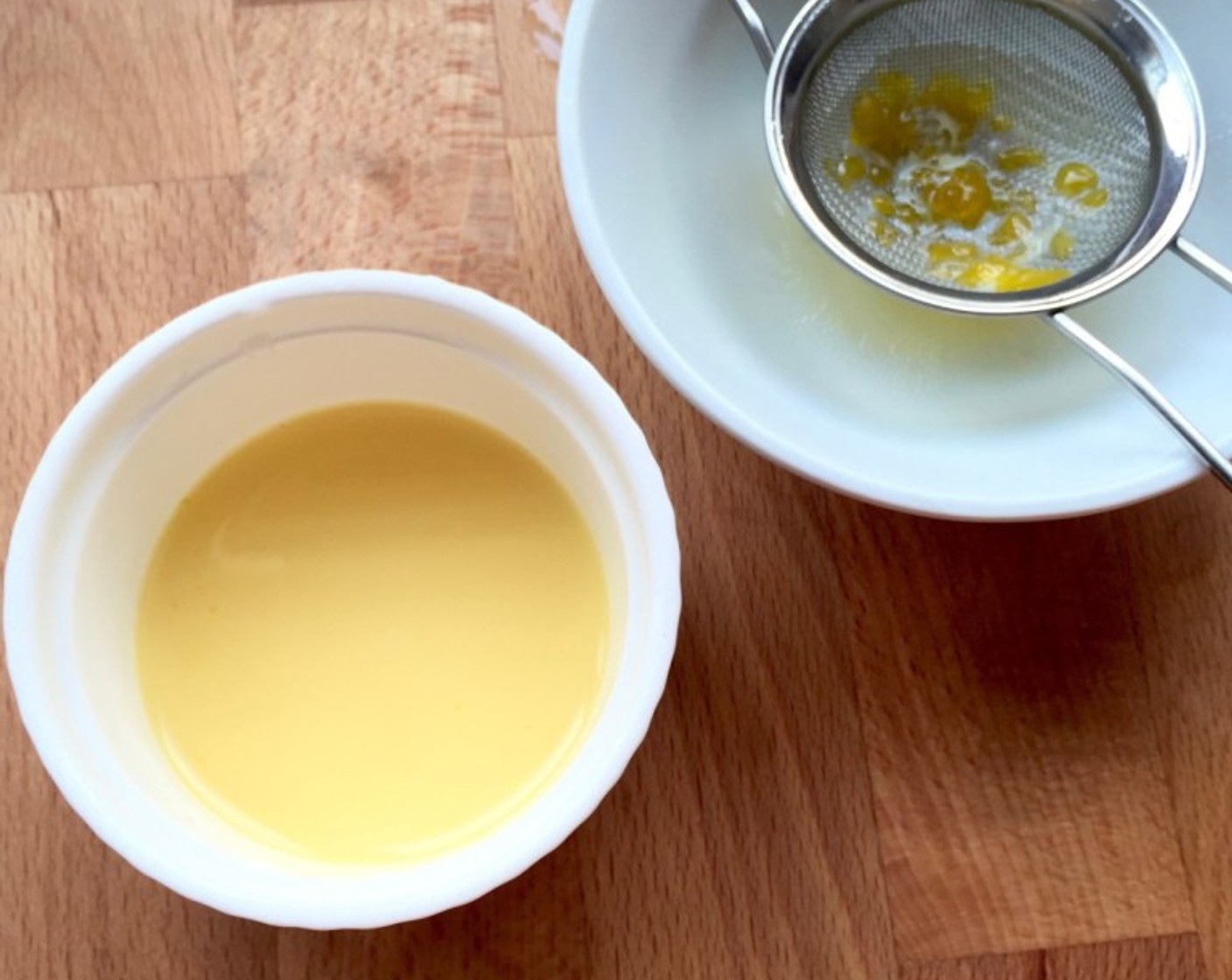 step 18 Meanwhile, in a small bowl, mix the remaining 1/4 Egg Yolk and Water (1 Tbsp) together for the glaze. Be sure to strain the egg wash through a sifter to remove any parts of the egg that didn't incorporate.