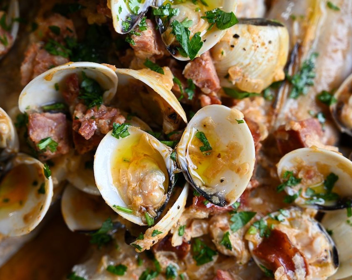 step 3 Add the Fresh Clams (1.1 lb) and cover with the lid. Steam the clams until open and stir half the Italian Flat-Leaf Parsley (1/2 handful) through the sauce. Set aside, keeping the sauce warm but not hot.