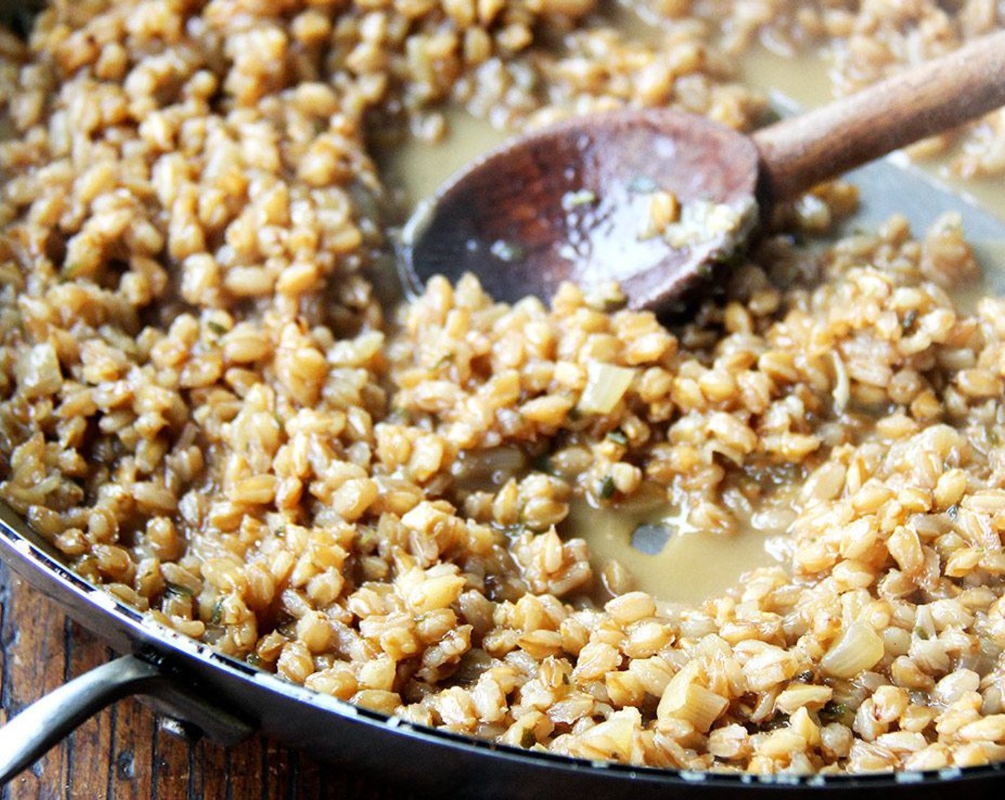 step 7 Continue cooking, adding ½ cup of warm stock at a time, stirring to prevent scorching and letting each addition be absorbed before adding the next, until the farro grains have expanded and are al dente, about 1 hour. The farro will look creamy like risotto.