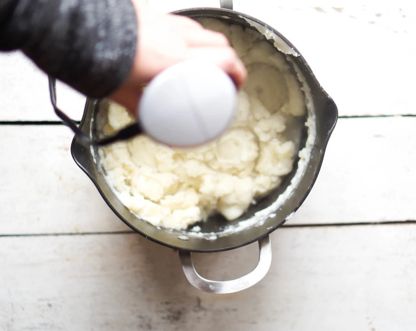 step 8 Drain the potatoes and return to the pot. Remove the thyme from the almond milk. Mash the potatoes while slowing adding the milk mixture. Mash until desired consistency achieved.