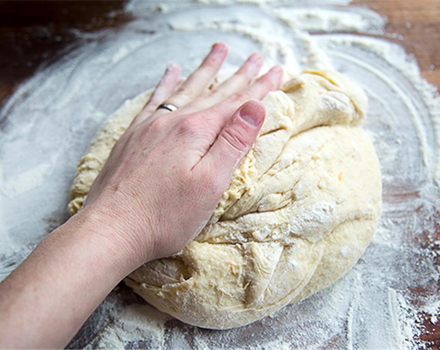 step 4 Turn the dough out onto a lightly floured surface and knead until smooth and elastic, about 5 minutes.