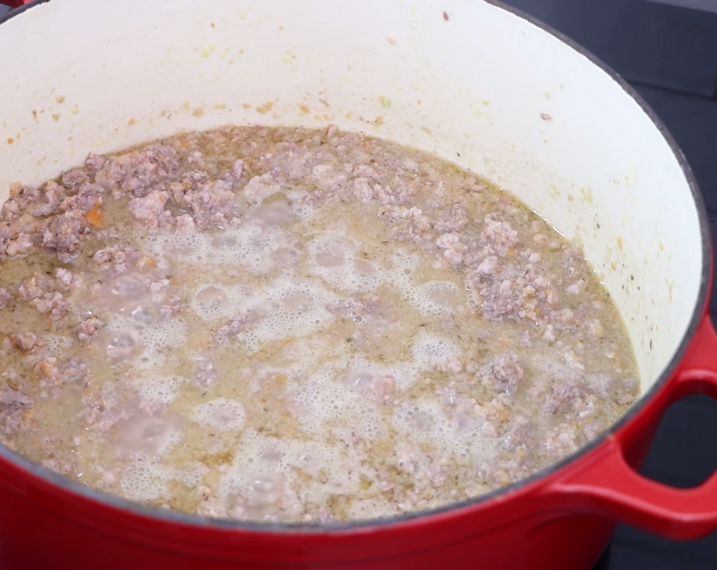 step 7 Leave the Bolognese sauce to simmer for approximately 5 minutes, stirring every so often. This should start to bubble as the wine evaporates.