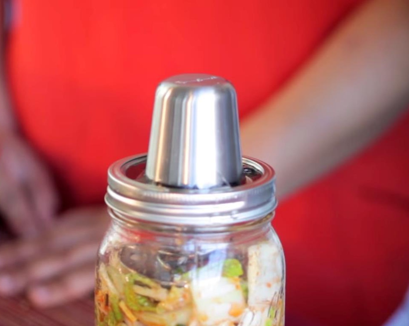 step 7 Secure Kraut Source system on top of the Mason jar.