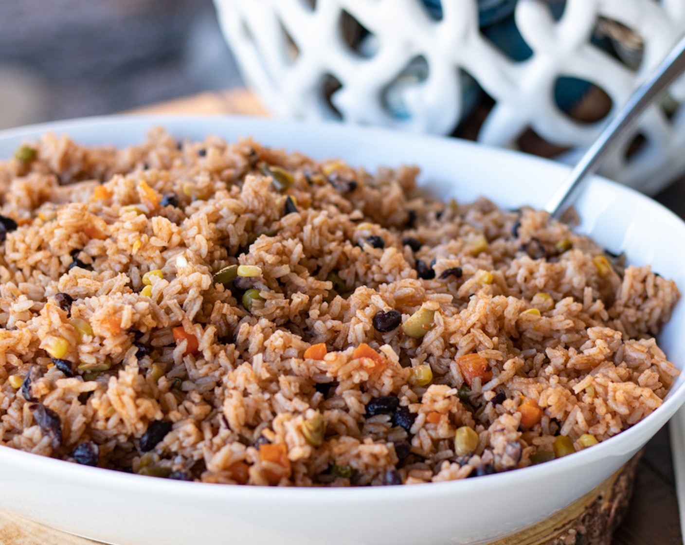 step 7 After 25 to 30 minutes, uncover rice and stir. Cover again for 5 minutes. Uncover, stir and it is ready to serve! We serve it with Pollo Guisado (Stewed Chicken), Rabo Guisado (Oxtail Stew), even with Dominican Fried Chicken Wings.