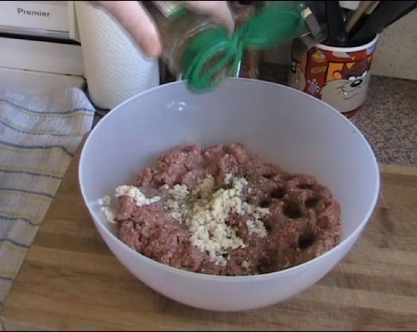 step 1 Put Ground Beef (3.3 lb) into a bowl. Add Onion (1), Dried Mixed Herbs (1 Tbsp), Breadcrumbs (2 cups) and Eggs (4). Mix them together.