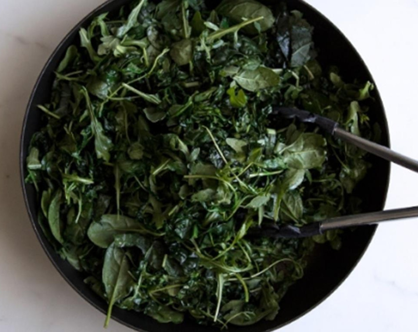 step 4 While the sauce is simmering, sauté the Fresh Baby Spinach (3 1/3 cups), Baby Arugula (5 cups) and shredded Tuscan Kale (8 stalks) in a pan with a little Olive Oil (as needed) until wilted, then remove from the heat and set aside.