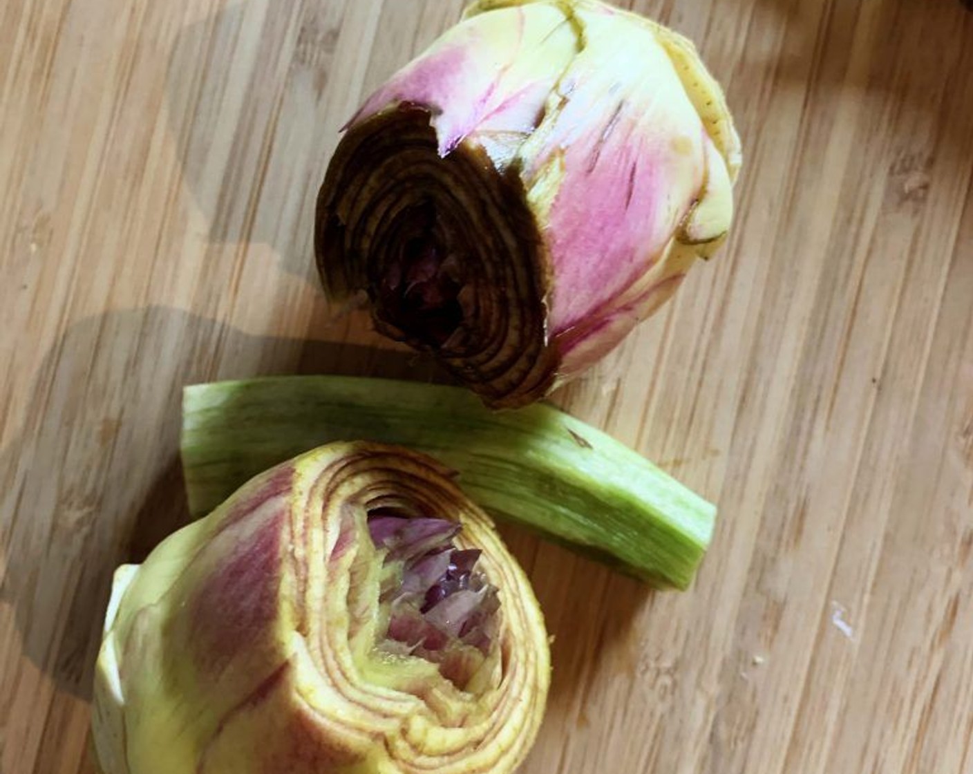 step 3 Remove the external leaves from the Artichokes (2), cut off the tips of the internal leaves, clean up the base. Then slice them and place them in a bowl with water and the juice of half a Lemon (1/2) (this will prevent the artichokes from going black).