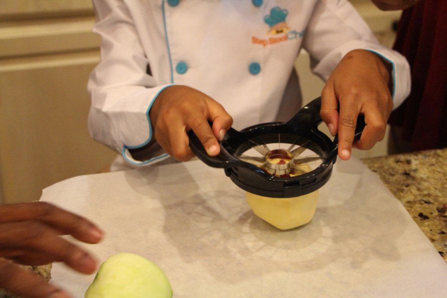 Step 2 of Apple Pie Bites Recipe: Peel the Apple (1) and cut into 8 slices around the core.