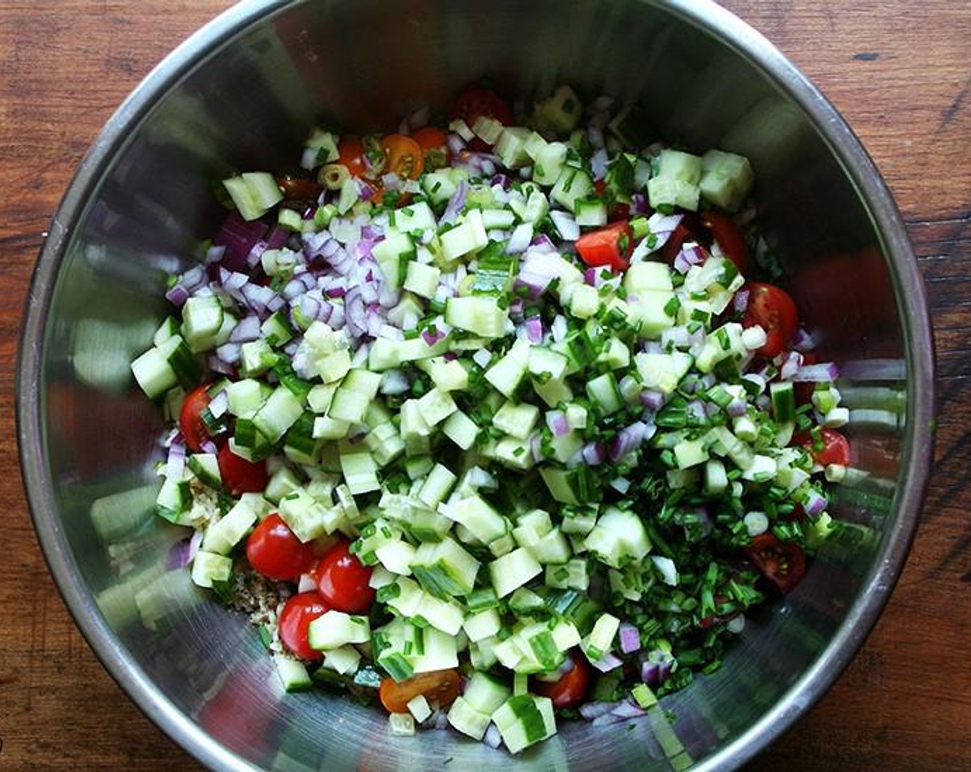 step 3 Spread the bulgur out into a large bowl. Season evenly with Salt (to taste) (I used 1 tsp) and Freshly Ground Black Pepper (to taste). Add all of the chopped vegetables and minced herbs. Pour in the Olive Oil (4 Tbsp) and juice from the Lemons (2). Toss well. Taste and adjust seasoning as necessary.