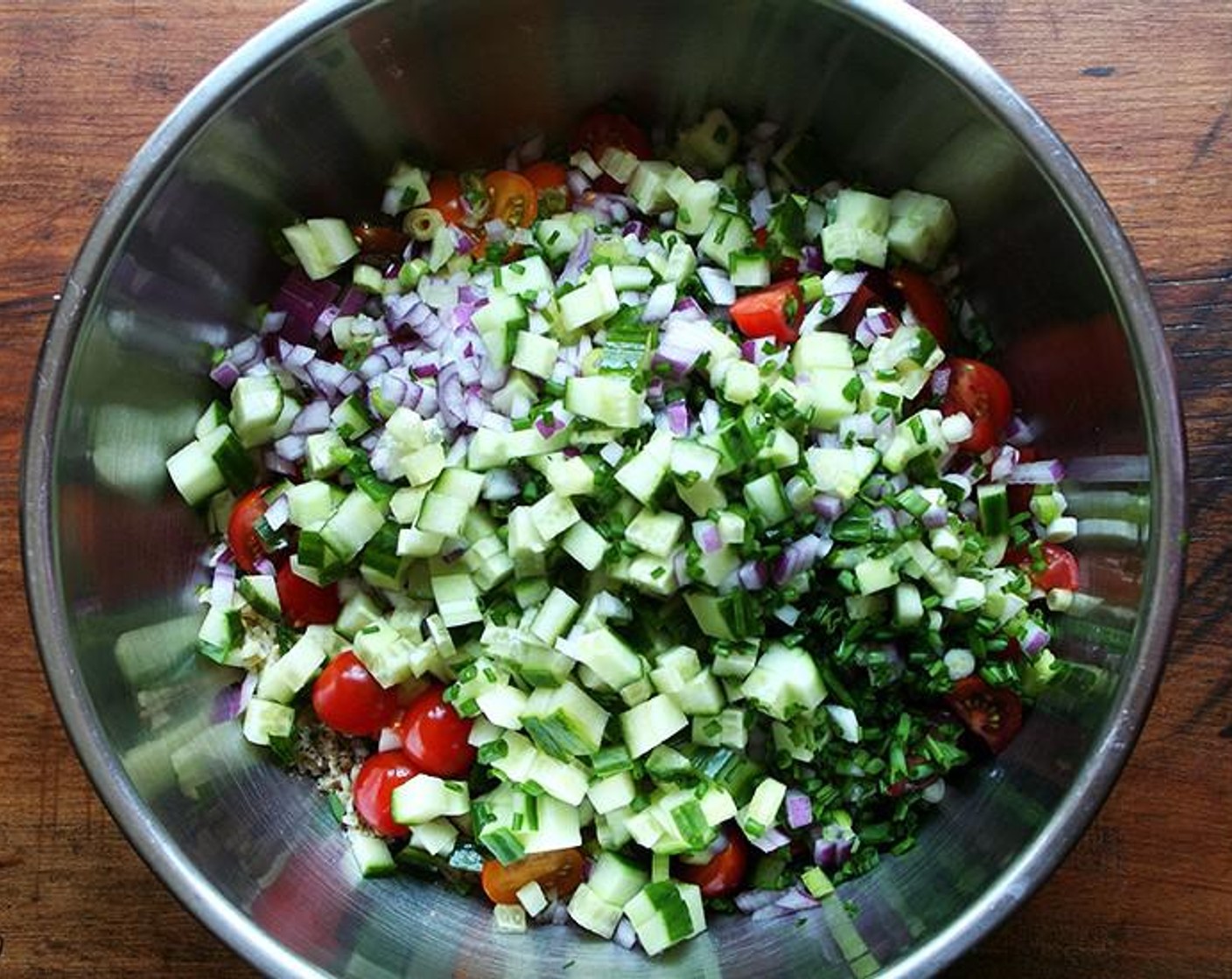 step 3 Spread the bulgur out into a large bowl. Season evenly with Salt (to taste) (I used 1 tsp) and Freshly Ground Black Pepper (to taste). Add all of the chopped vegetables and minced herbs. Pour in the Olive Oil (1/4 cup) and juice from the Lemons (2). Toss well. Taste and adjust seasoning as necessary.