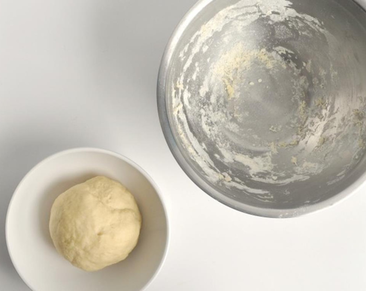 step 3 Knead until the dough is smooth, about 7 minutes, and place in a large bowl, covered with a damp towel. Let rise for 2 hours.