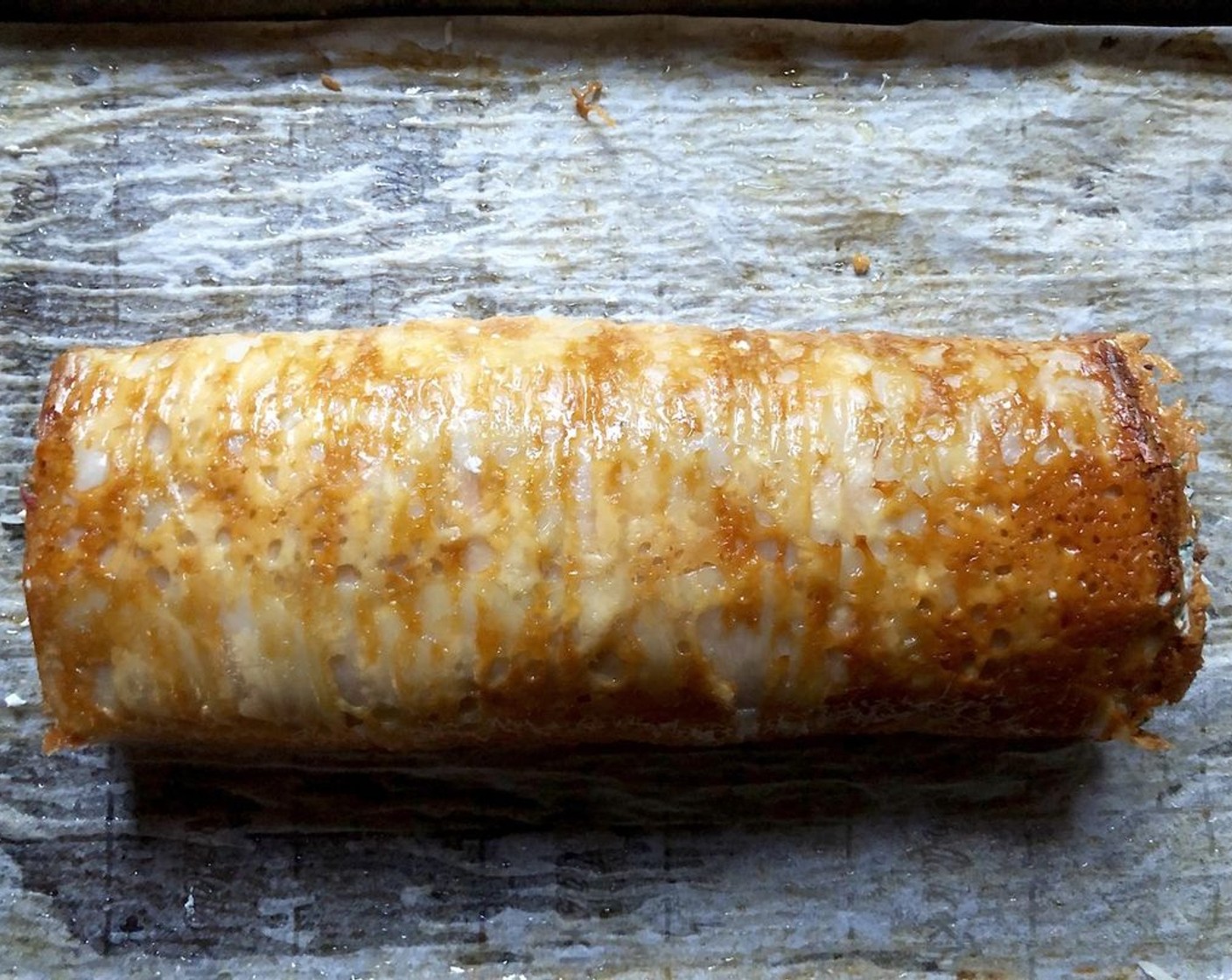 step 11 Once completely rolled, place the potato roll on the parchment paper with the seam side down. Bake for 15 minutes.